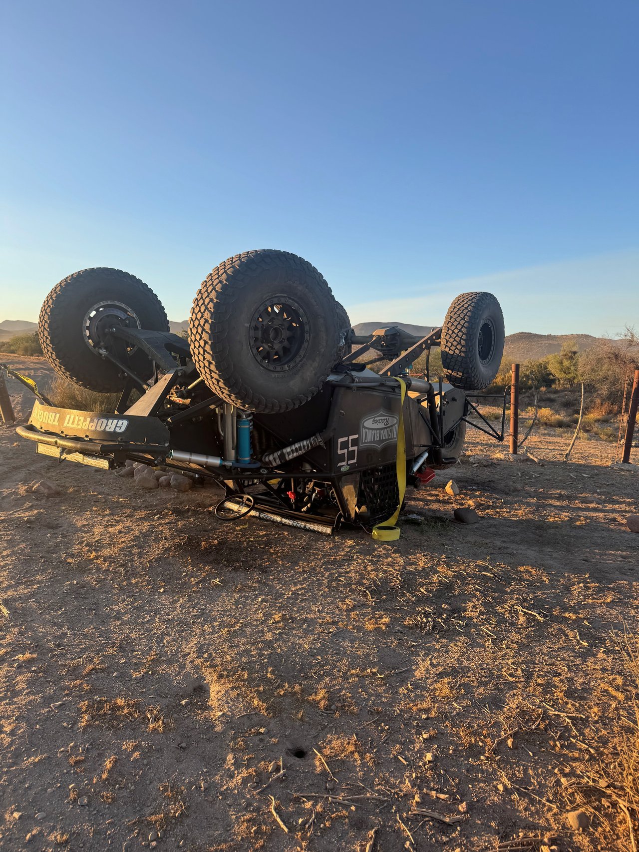 #55 Trophy Truck upside down on desert course after cattle-guard post hit — RECORD Ensenada San Felipe 250