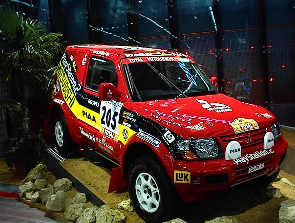 The No. 205 Mitsubishi Pajero in Jutta Kleinschmidt's 2001 Dakar colors on display at the IAA in Frankfurt, photo by Axel Schwenke