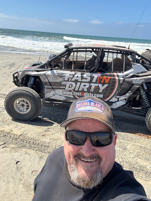 The Fast 'N Dirty car on the beach during the La Raza pre-run.